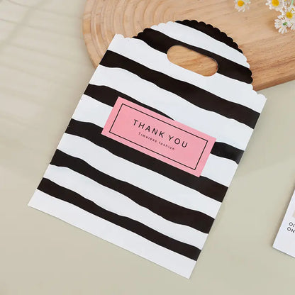 50pcs, 3 Styles Stripe Heart Smile wavy handle PVC gift bag - ByHome