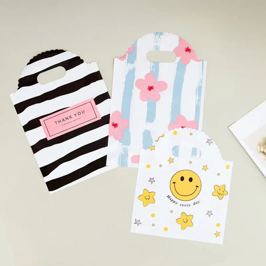 50pcs, 3 Styles Stripe Heart Smile wavy handle PVC gift bag - ByHome